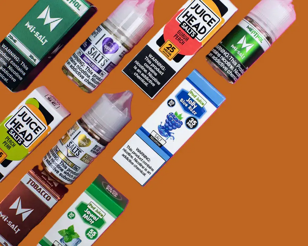 Assorted vape juices and nicotine salt e-liquids with colourful packaging, featuring vape flavours and vapes products on an orange background.